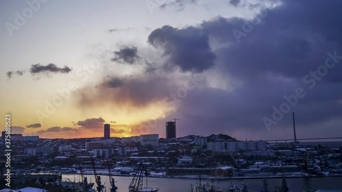 time laps of the urban landscape with a view of the dawn over the Bay of Diomede. Vladivostok, Russia photo