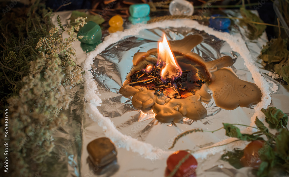 Candle for cleansing a person, magic rituals and wax casting, energy cleansing. Altar of modern witch.