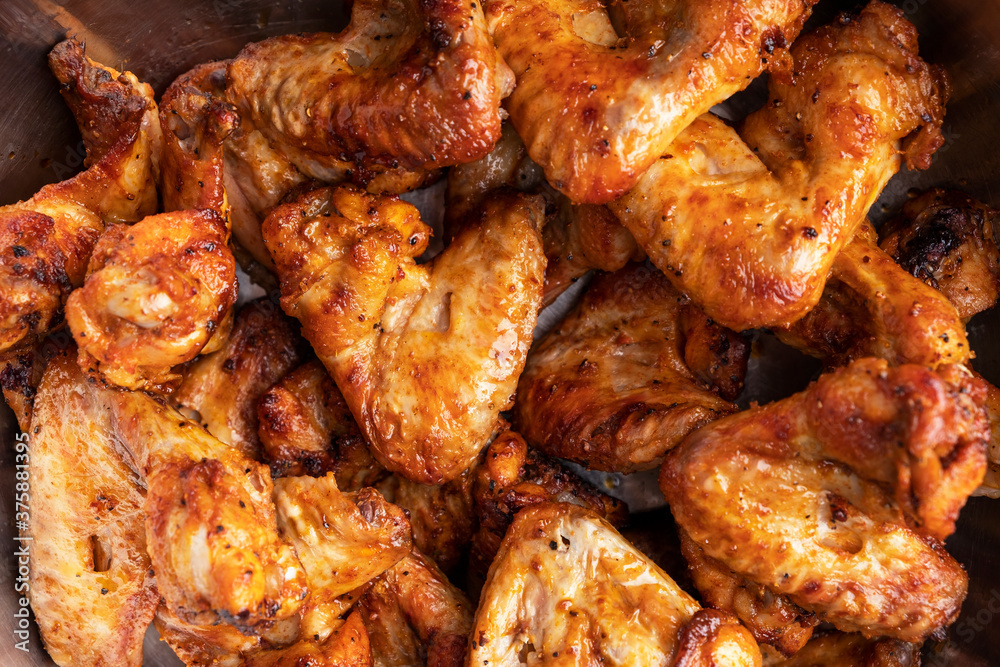 Grilled chicken wings background. Top view