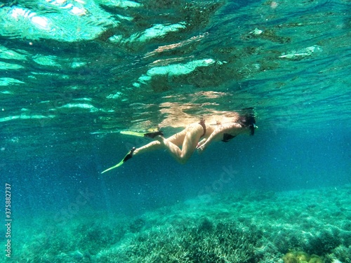 Photography woman snorkeling in the ocean in Zanzibar