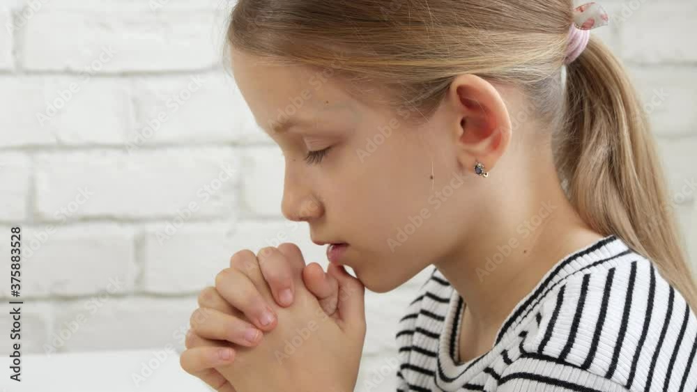 Kid Praying Before Eating Breakfast in Kitchen, Child Preparing to Eat Meal, Christian Girl Religious View at Home Kid Praying Before Eating Breakfast in Kitchen, Child Preparing to Eat Meal, Christian Girl Religious View at Home