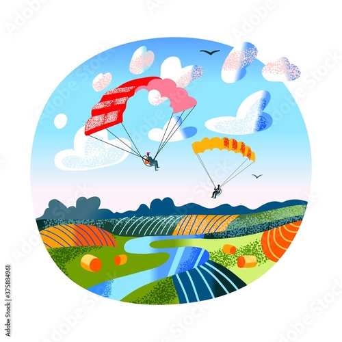 People fly on paragliders over fields and river landscape
