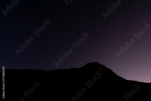 Real Night Sky Stars Background With Natural Colourful Sky Gradient. Sunset, Sunrise Light And Starry Sky. Yellow And Black Colors.