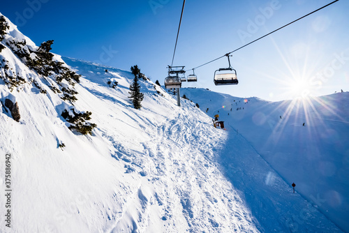 Gondola lift on the snowy slopes of the Brenta Dolomites - Alps photo