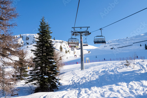 Gondola lift on the snowy slopes of the Brenta Dolomites - Alps