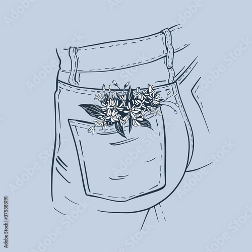 Denim pocket with flowers. Element of the buttocks in jeans with a bouquet of daisies in the pocket. Lifestyle picture