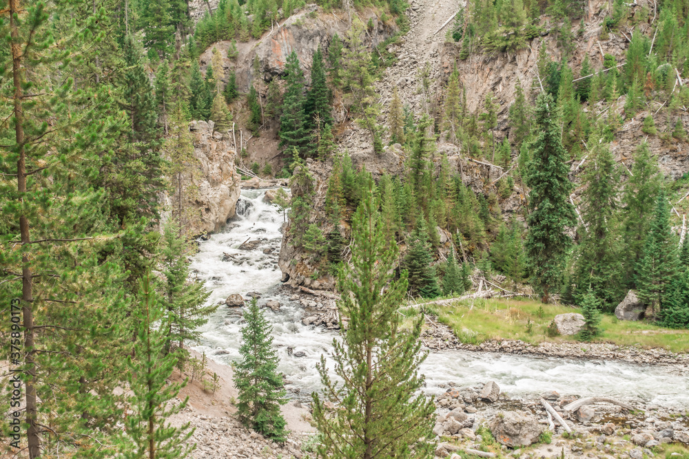 Waterfall in the Firehole River at the Firehole canyon road Waterfall in the Firehole River at the Firehole canyon road
