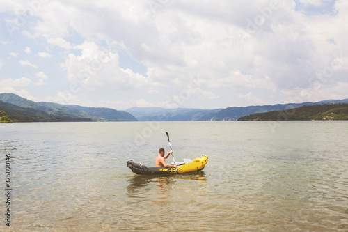 River kayaker man , kayaking on Danube river , Summer Vacation © mitarart