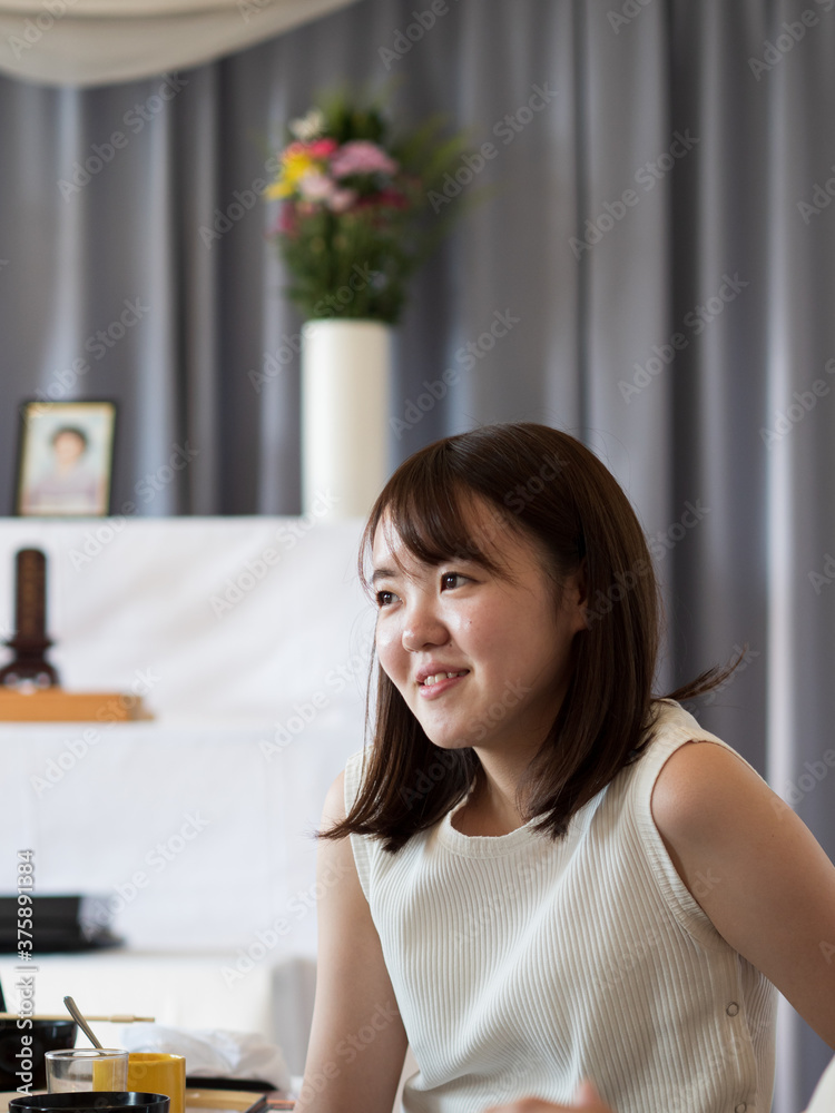 a young woman talking happily while attending an event dinner a young woman talking happily while attending an event dinner