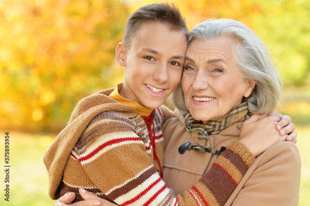 Fototapeta premium Close up portrait of happy grandmother and grandson posing