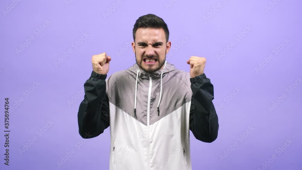 Young caucasian man screaming angry, expression of madness and mental instability, madness concept Young caucasian man screaming angry, expression of madness and mental instability, madness concept