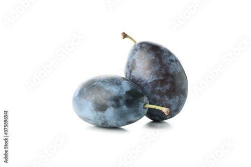 Fresh blue plums isolated on white background