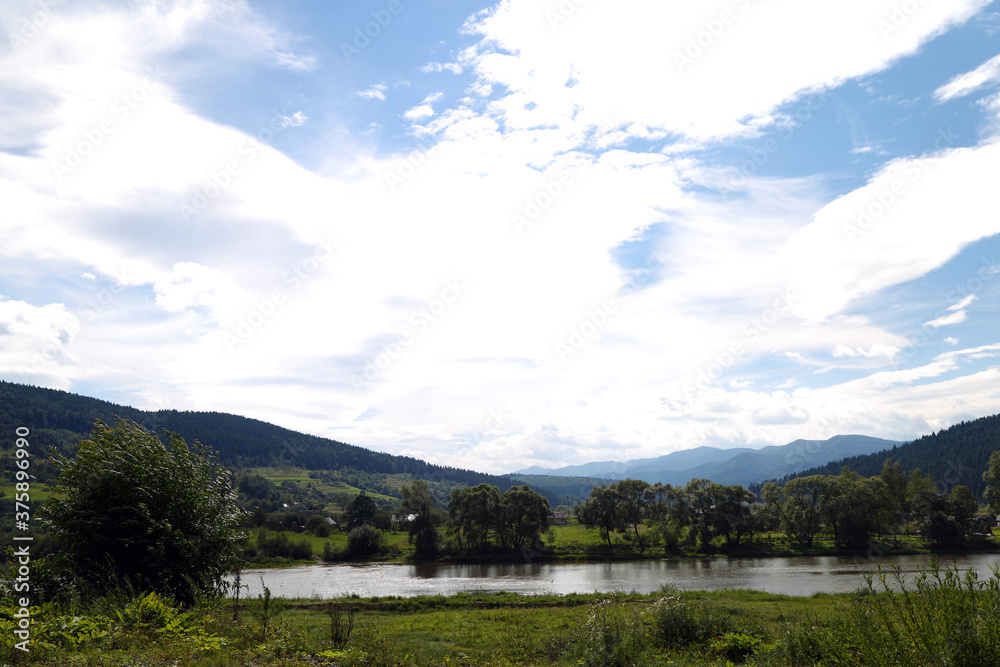 summer landscape with mountains and river