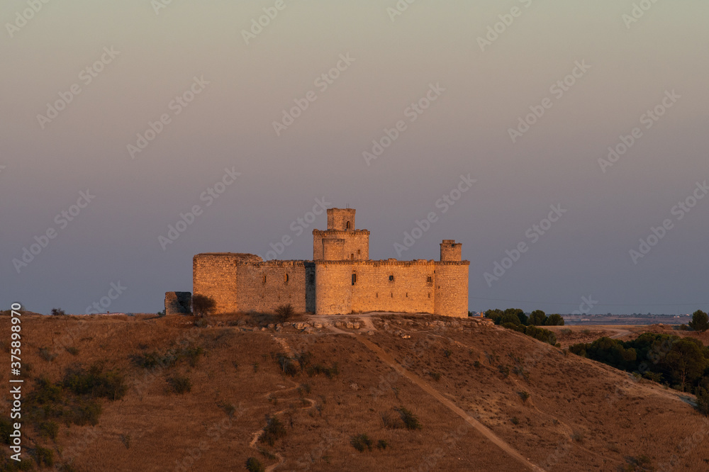 View of Castle of Barcience during sunset, built in the 15th century near the city of Toledo.