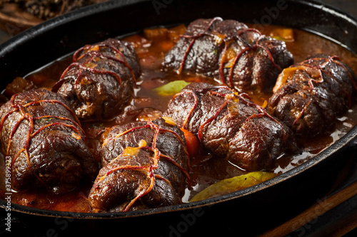 Dish of beef, bacon and pickle roulades in gravy