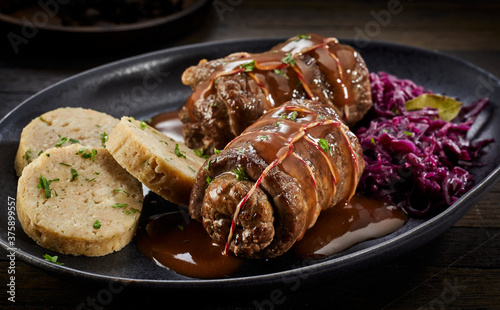 Serving of traditional beef roulade in gravy photo