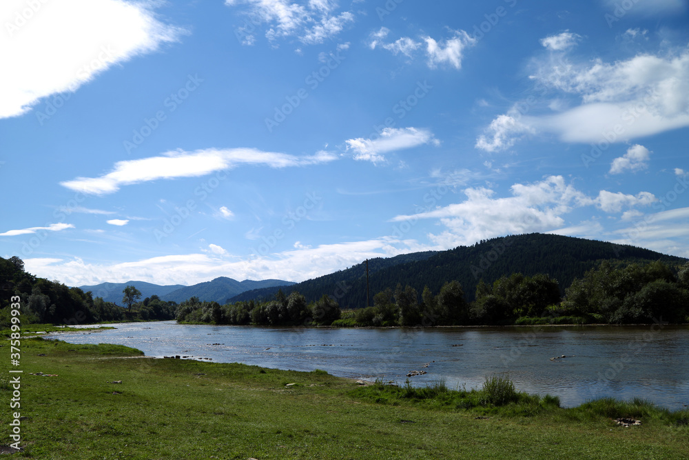 summer landscape with mountains and river