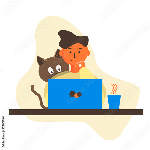 A man is sitting at a Desk working on a laptop. Cat sitting with a guy in front of a laptop