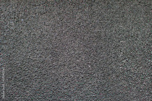 Black abstract background texture of cement or bitumen.