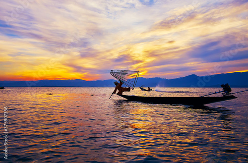 Tricks of fishermen on Inle Lake, Intha, Myanmar photo