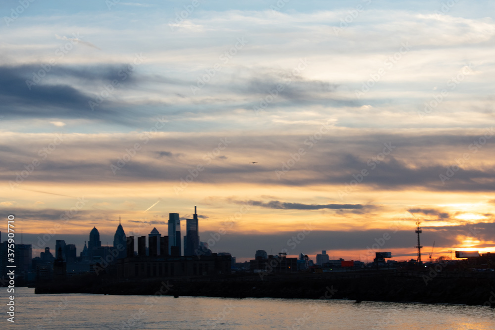 A View of the Philadelphia Skyline Over Water on a Dramatic Sunset