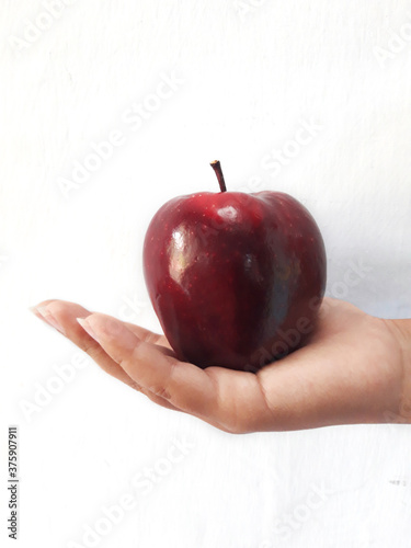 red apple in hand