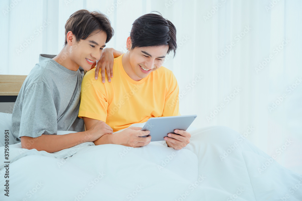 Gay couple at home in penthouse,Happy moment in bedroom or morning Gay couple at home in penthouse,Happy moment in bedroom or morning