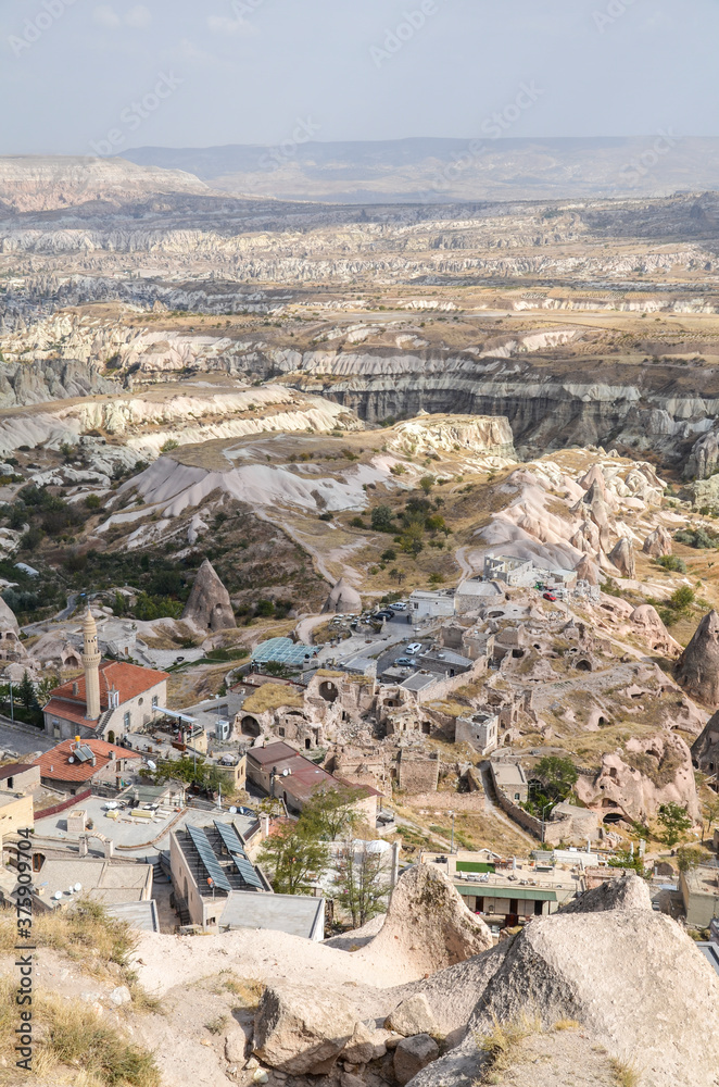 Amazing view to the cave town Uchisar from the ancient mountain fortress. Cappadocia, Turkey.