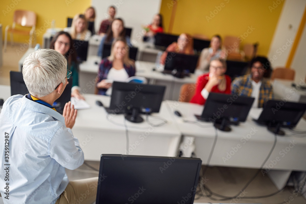 Teacher with pupils in classroom