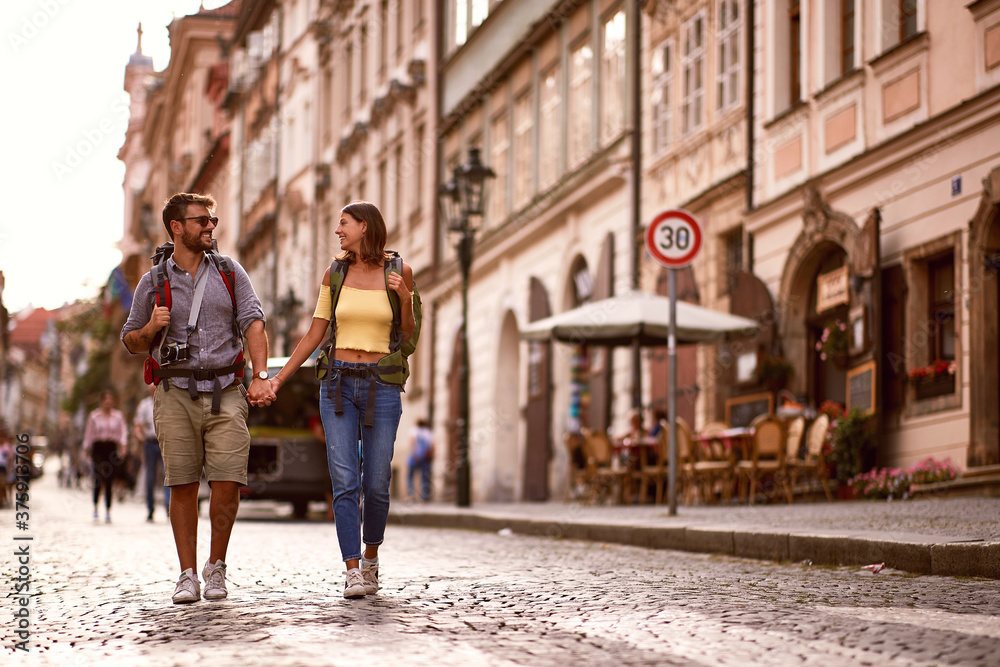 A lovely tourist couple walking the city