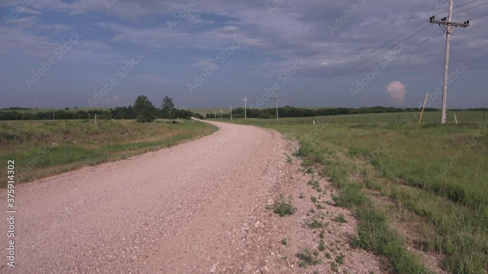country road with storm clouds approaching country road with storm clouds approaching