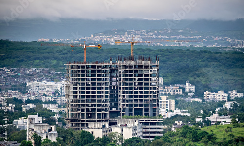 Twin, tall buildings under construction in Pune, Maharashtra, India. photo