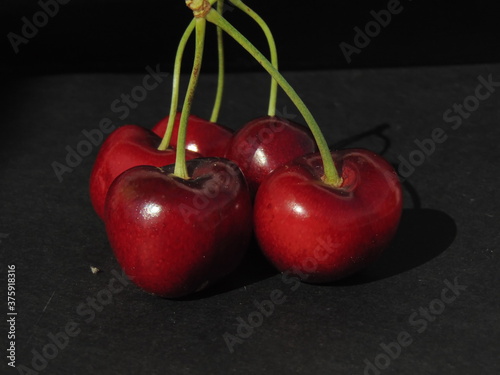 red cherries on black background