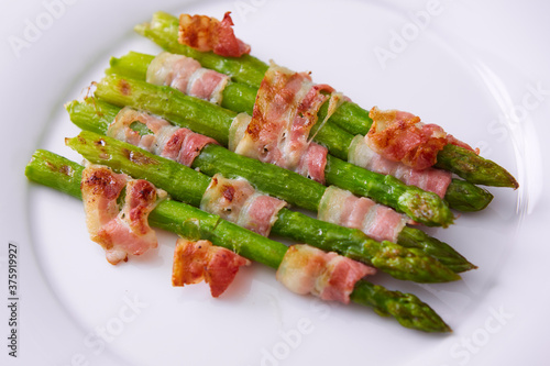 The Asparagus wrapped in bacon. Shallow dof