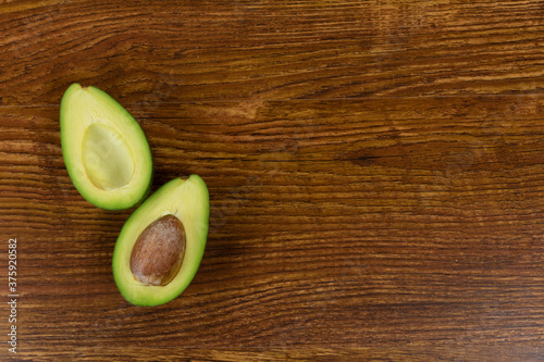 View of an avocado on wood table background