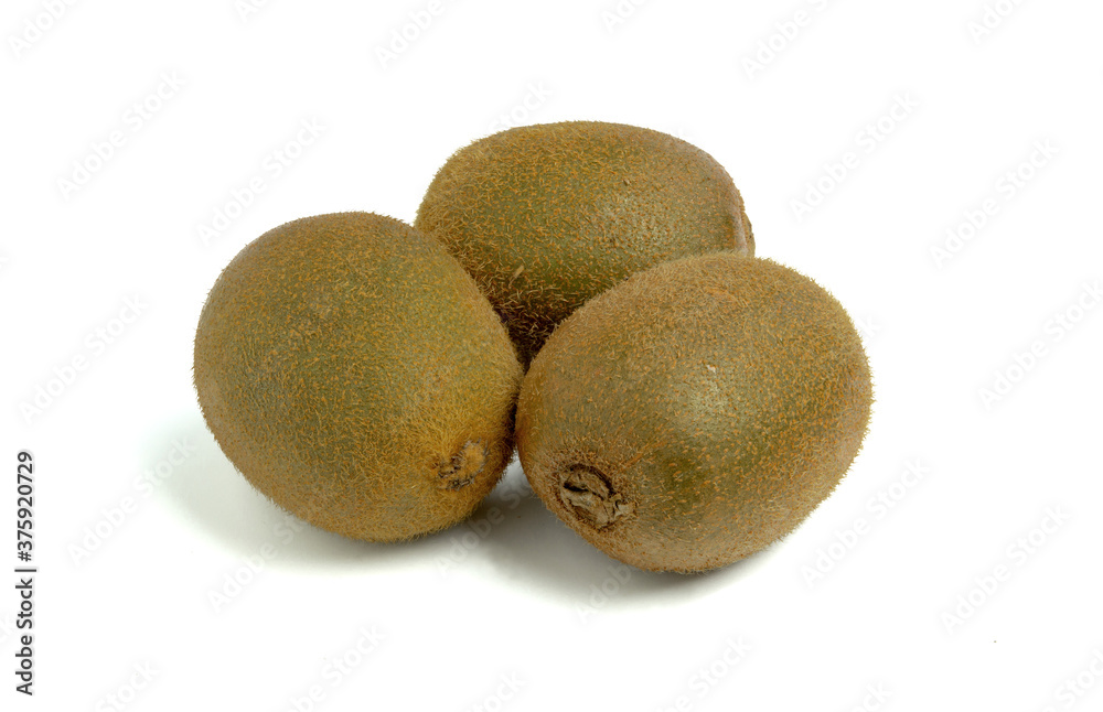 Three whole kiwis, isolated on a white background. Three whole kiwis, isolated on a white background.