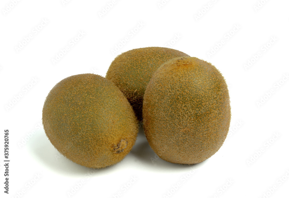 Three whole kiwis, isolated on a white background. Three whole kiwis, isolated on a white background.