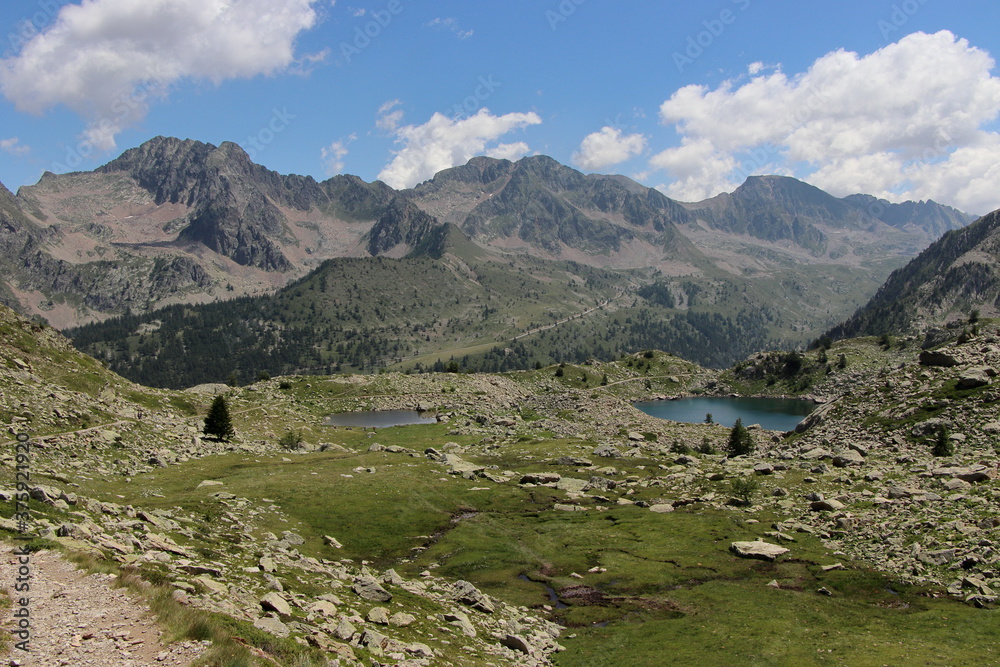 Jaw-droppingly beautiful mountains and lakes in Sant'Anna di Vinadio on a partly cloudy day.