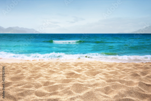 yellow warm sandy beach and summer sea with sky landscape