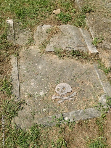 old tombstone on the grave with the symbol of the skull and bones located near Karadjordj's church in Topola Serbia, Balkans