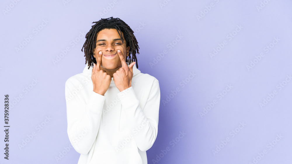 Young african american rasta man doubting between two options. Young african american rasta man doubting between two options.