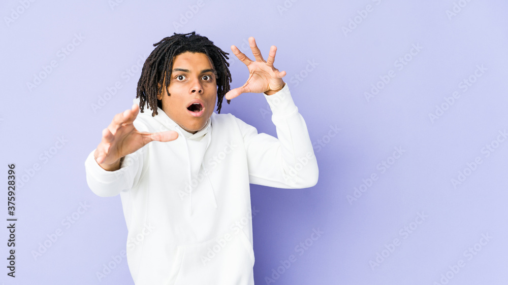 Young african american rasta man being shocked due to an imminent danger Young african american rasta man being shocked due to an imminent danger