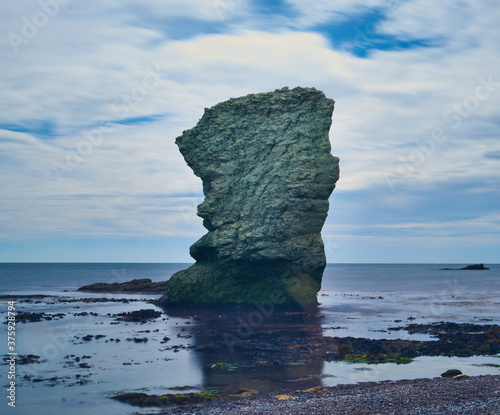 Beautiful shot of a giant rock in a sea, Dorset AONB, Dorchester UK photo