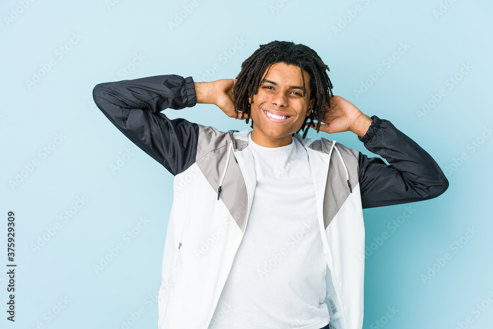 Young african american sport man stretching arms, relaxed position.