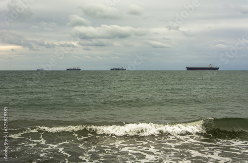 Four ships in the horizon photo