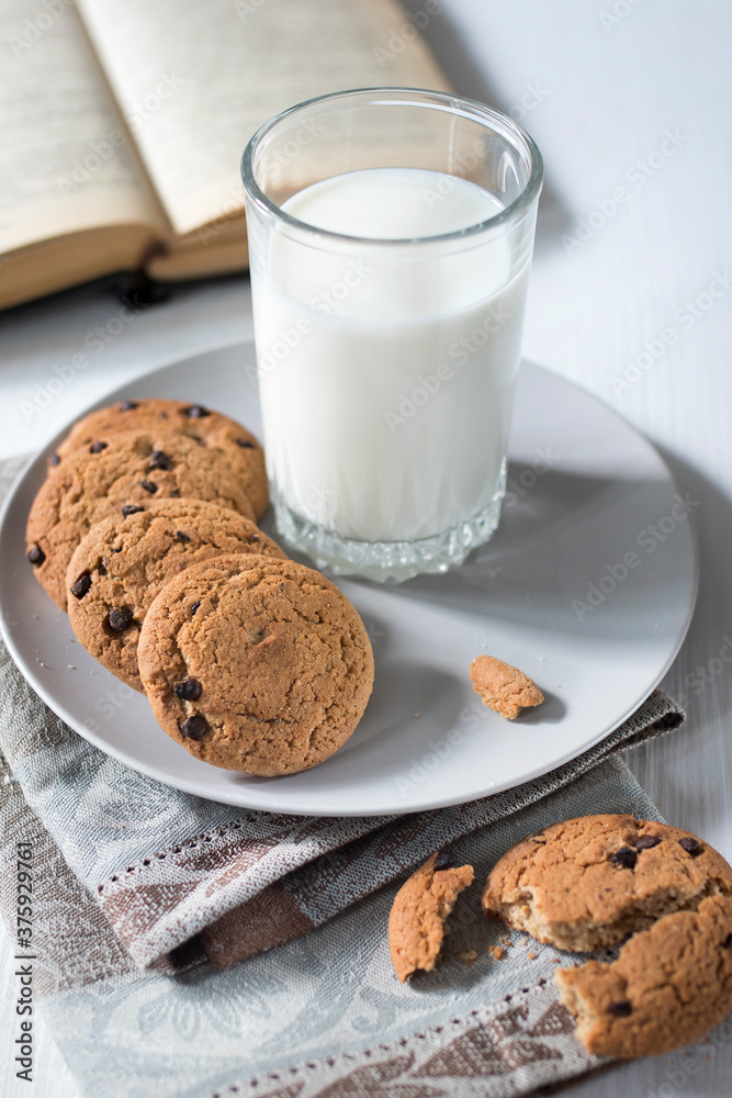 Tasty cookies and glass of milk on rustic wooden background Tasty cookies and glass of milk on rustic wooden background