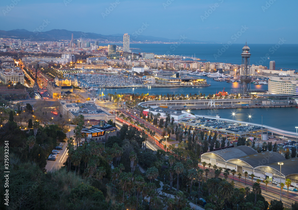 Barcelona - The city with the harbor at the dusk.