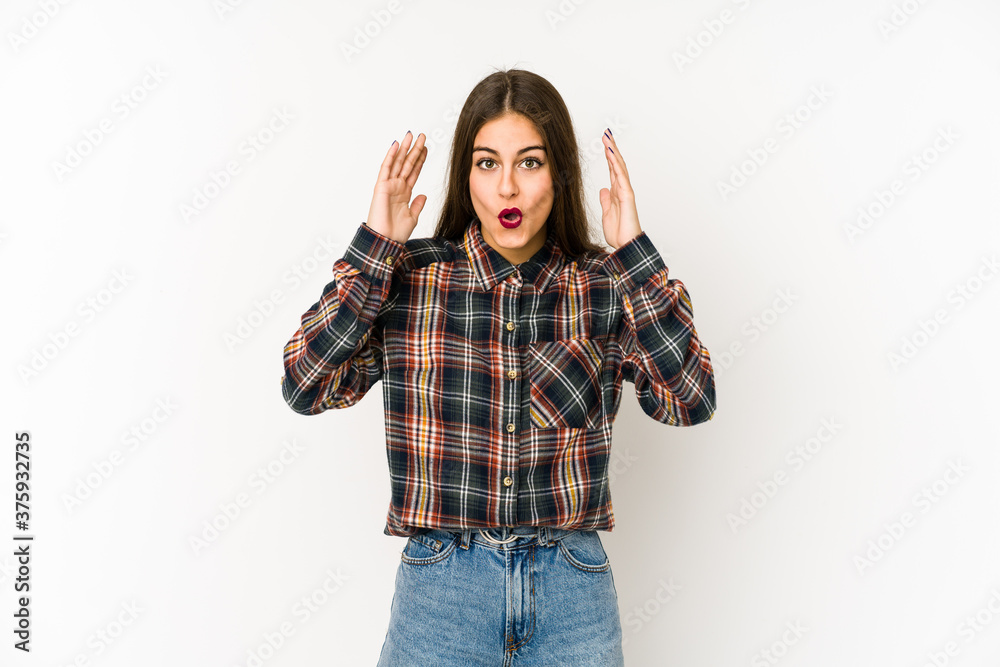 Young caucasian woman isolated on white background surprised and shocked. Young caucasian woman isolated on white background surprised and shocked.