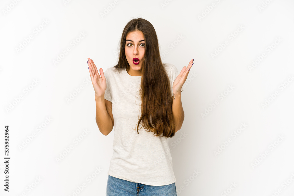 Young caucasian woman isolated on white background surprised and shocked.