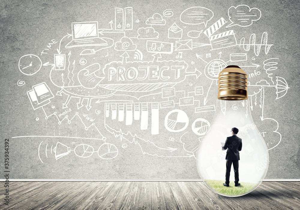 Businessman trapped in bulb Businessman trapped in bulb